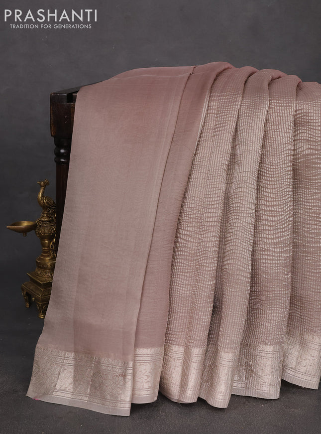 Pure organza partly silk saree grey shade and paste peach with allover silver zari weaves and silver zari woven border