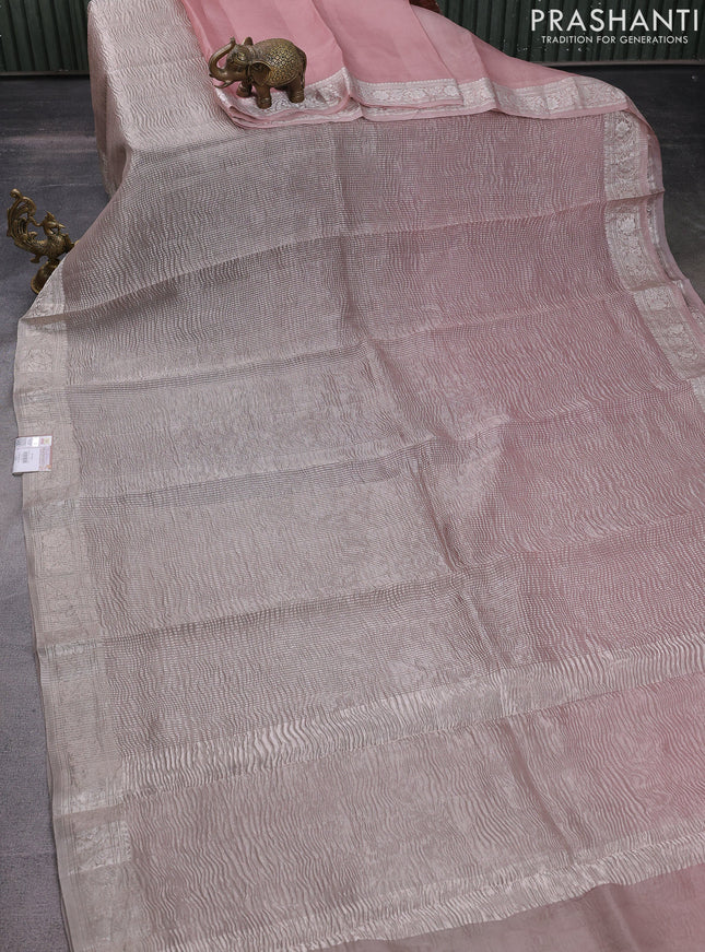 Pure organza partly silk saree grey shade and paste peach with allover silver zari weaves and silver zari woven border