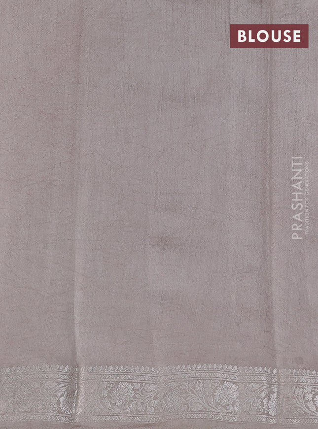 Pure organza partly silk saree grey shade and paste peach with allover silver zari weaves and silver zari woven border