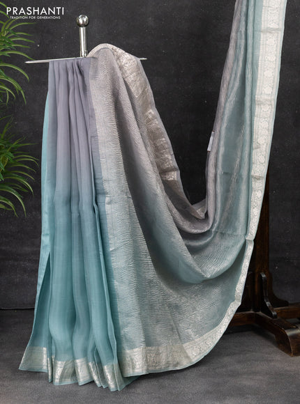 Pure organza partly silk saree grey and pastel blue with allover silver zari weaves and silver zari woven border