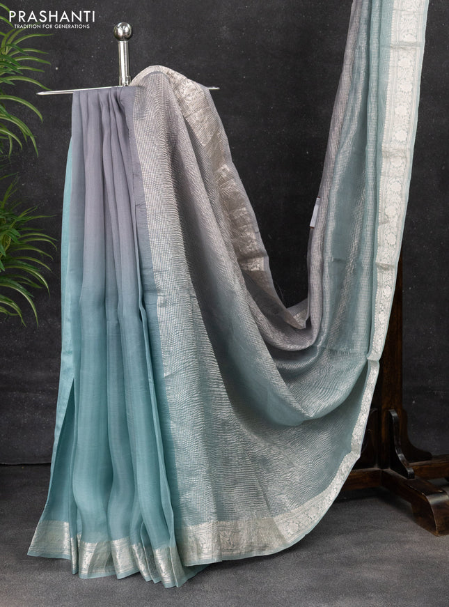 Pure organza partly silk saree grey and pastel blue with allover silver zari weaves and silver zari woven border