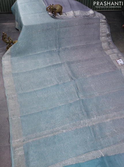 Pure organza partly silk saree grey and pastel blue with allover silver zari weaves and silver zari woven border
