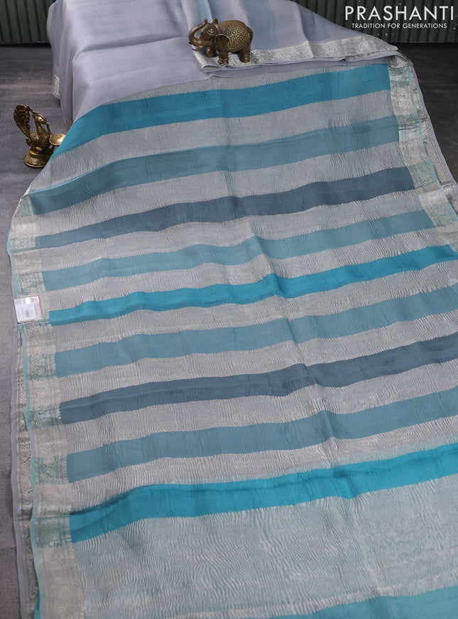 Pure organza partly silk saree pastel blue with silver zari stripe pattern and silver zari woven border
