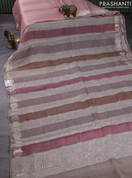 Pure organza partly silk saree pastel peach and grey shade with silver zari stripe pattern and silver zari woven floral border