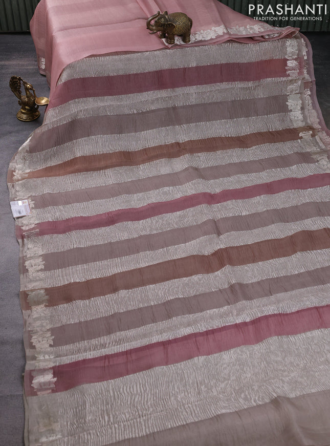 Pure organza partly silk saree pastel peach and grey shade with silver zari stripe pattern and silver zari woven floral border