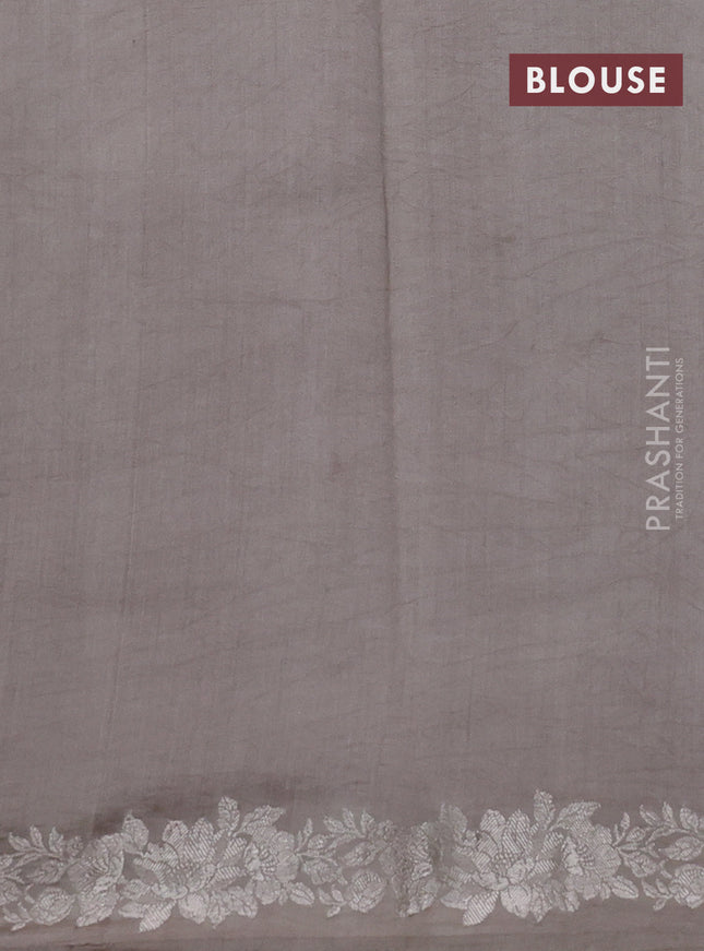 Pure organza partly silk saree pastel peach and grey shade with silver zari stripe pattern and silver zari woven floral border