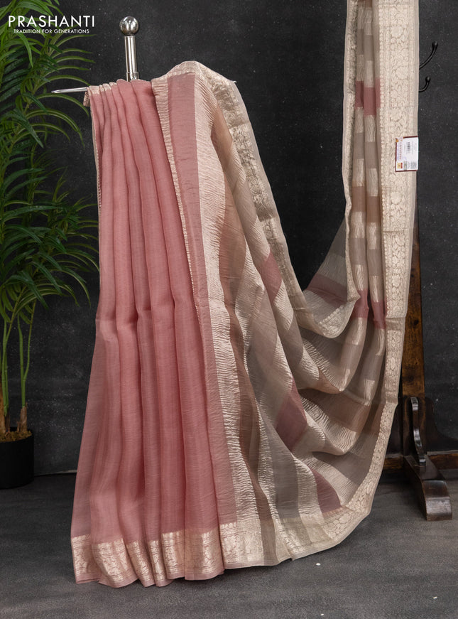 Pure organza partly silk saree pastel peach and grey shade with silver zari stripe pattern and silver zari woven border