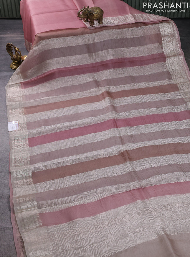 Pure organza partly silk saree pastel peach and grey shade with silver zari stripe pattern and silver zari woven border