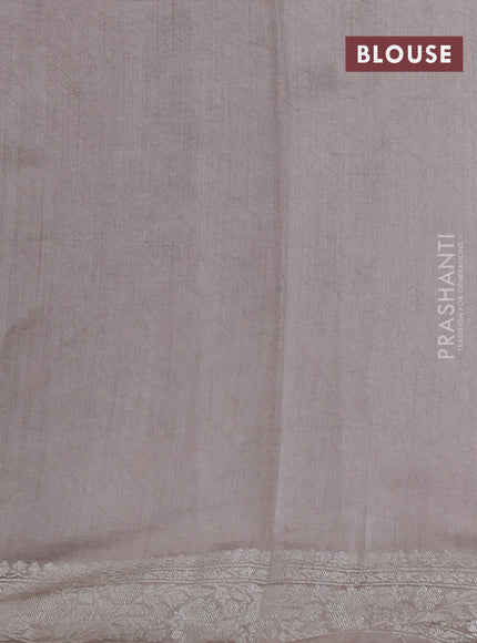Pure organza partly silk saree pastel peach and grey shade with silver zari stripe pattern and silver zari woven border