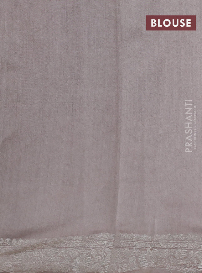 Pure organza partly silk saree pastel peach and grey shade with silver zari stripe pattern and silver zari woven border