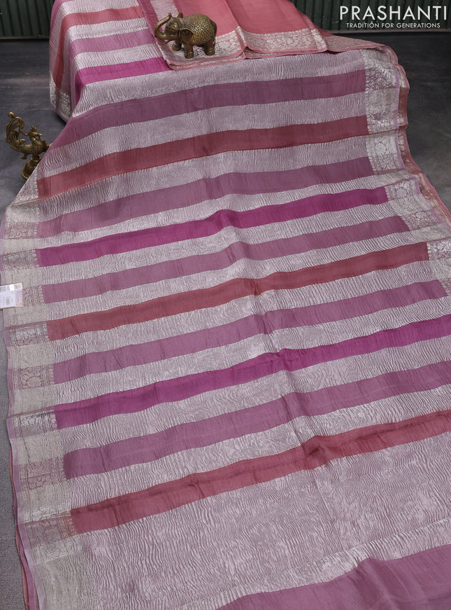 Pure organza partly silk saree pastel pink and pastel peach with silver zari stripe pattern and silver zari woven border