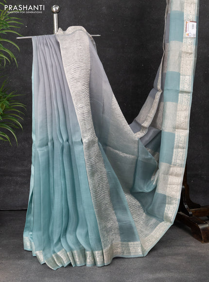 Pure organza partly silk saree grey and pastel blue with silver zari stripe pattern and silver zari woven border