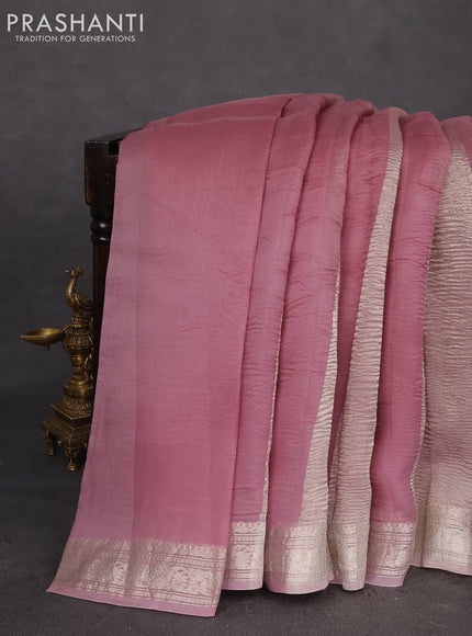 Pure organza partly silk saree pastel peach and pastel pink with silver zari stripe pattern and silver zari woven border