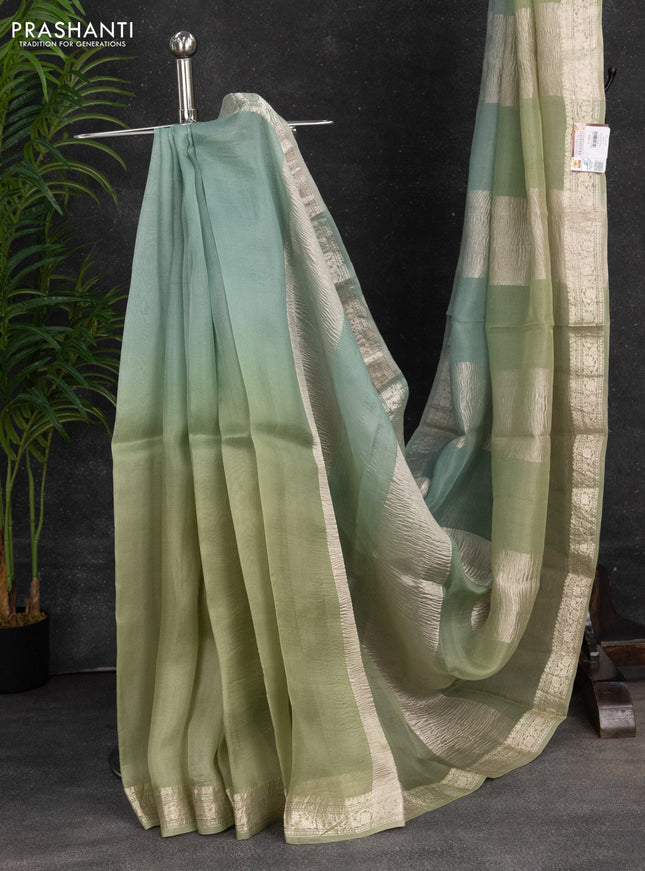 Pure organza partly silk saree pastel green and pastel blue with silver zari stripe pattern and silver zari woven border