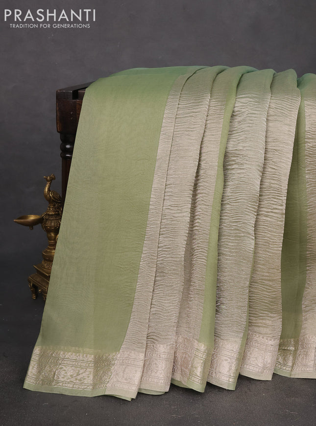 Pure organza partly silk saree pastel green and pastel blue with silver zari stripe pattern and silver zari woven border