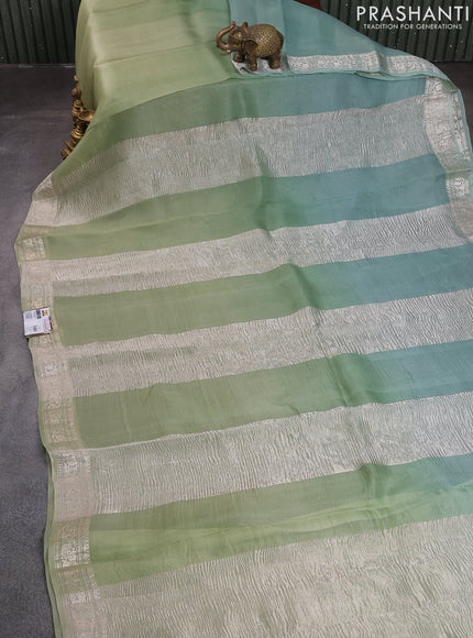 Pure organza partly silk saree pastel green and pastel blue with silver zari stripe pattern and silver zari woven border