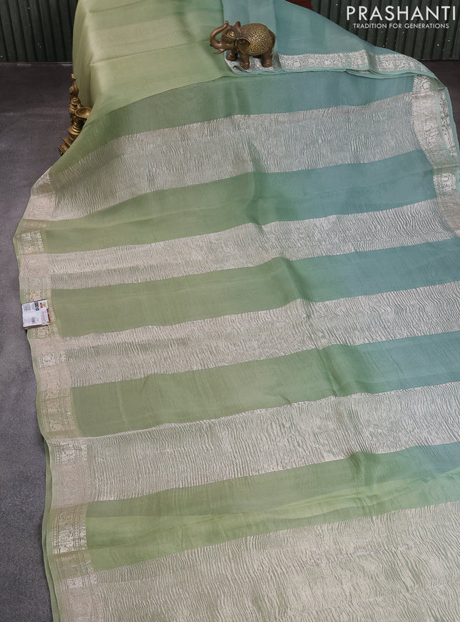 Pure organza partly silk saree pastel green and pastel blue with silver zari stripe pattern and silver zari woven border