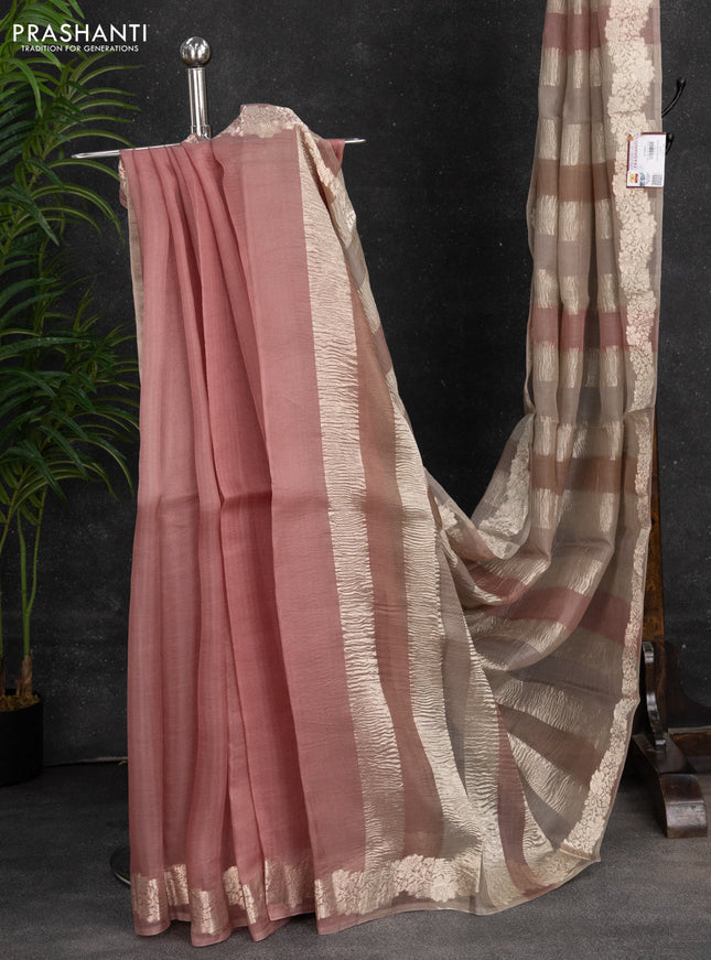 Pure organza partly silk saree beige and pastel peach with silver zari stripe pattern and silver zari woven border