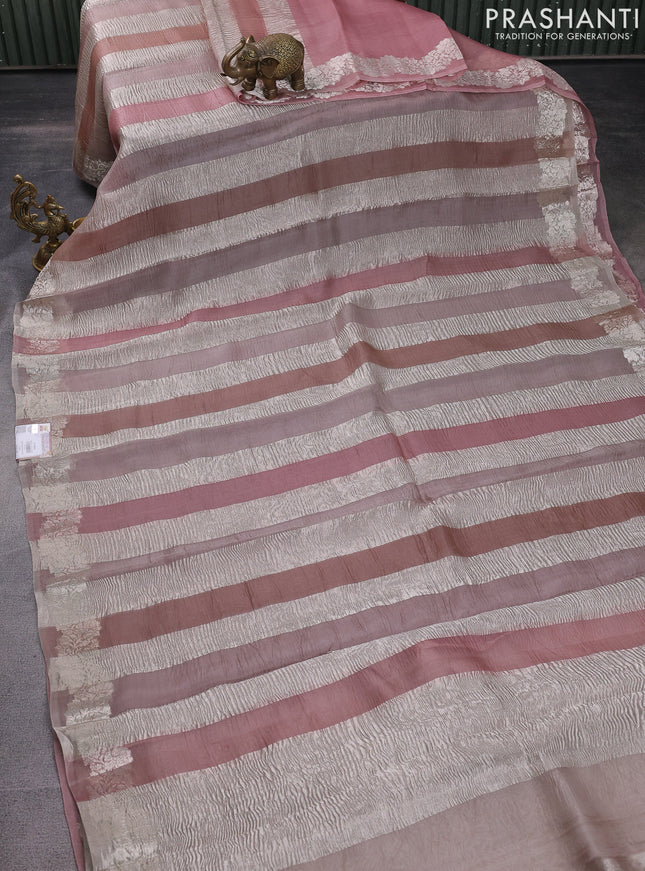 Pure organza partly silk saree beige and pastel peach with silver zari stripe pattern and silver zari woven border