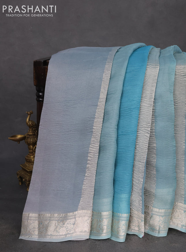 Pure organza partly silk saree pastel blue with allover silver zari weaves and silver zari woven border