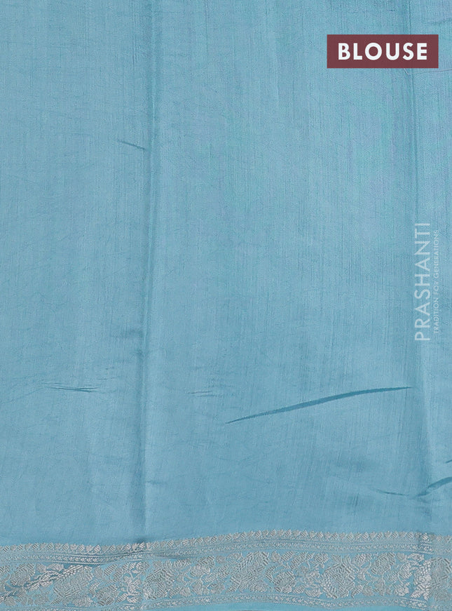 Pure organza partly silk saree pastel blue with allover silver zari weaves and silver zari woven border