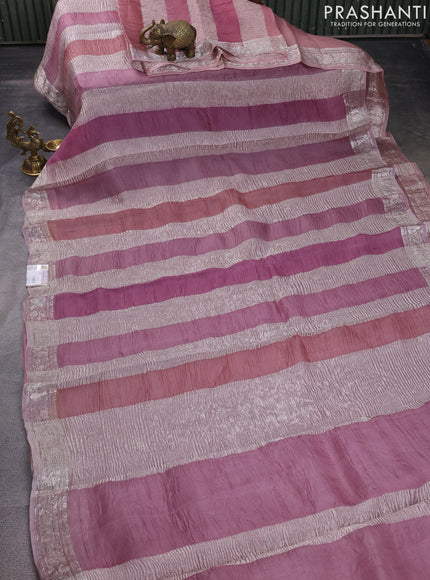 Pure organza partly silk saree pastel lavender and pastel pink with allover silver zari weaves and silver zari woven border