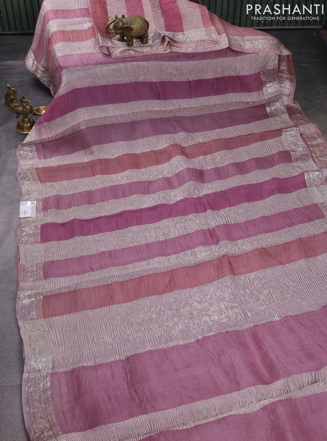 Pure organza partly silk saree pastel lavender and pastel pink with allover silver zari weaves and silver zari woven border