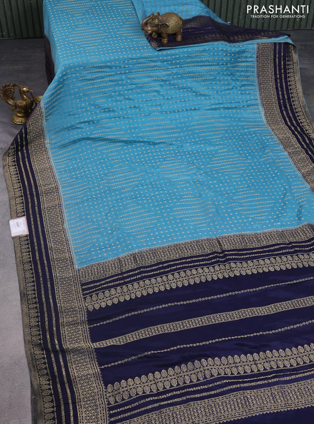 Banarasi semi crepe saree pastel blue and navy blue with allover zari woven butta weaves and zari woven border