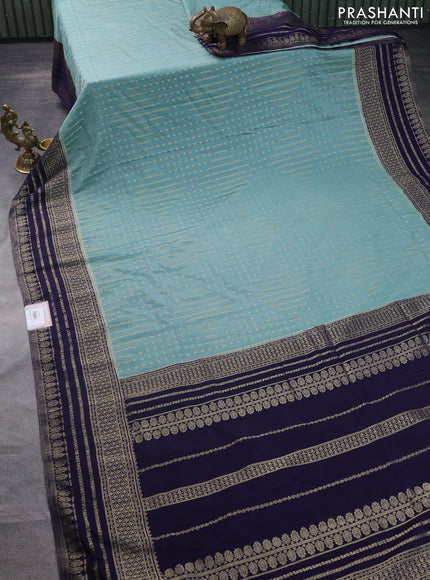 Banarasi semi crepe saree pastel green and navy blue with allover zari woven butta weaves and zari woven border