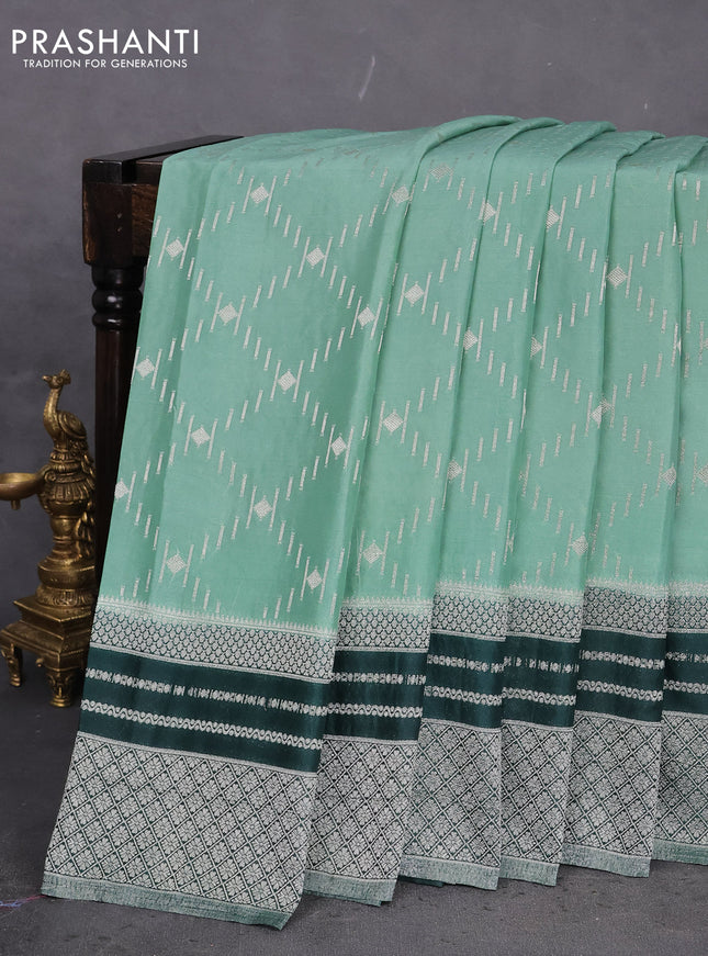 Banarasi semi crepe saree pastel green and dark green with allover silver zari weaves and silver zari woven border