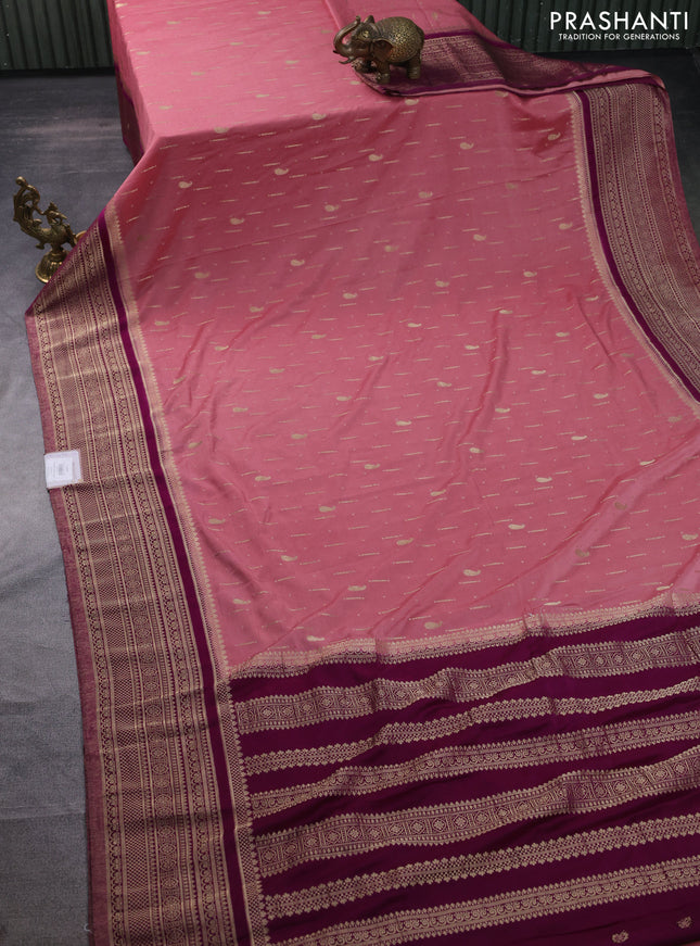 Banarasi semi crepe saree peach pink and purple with allover zari woven butta weaves and long zari woven border