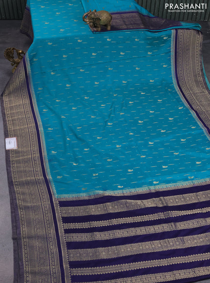 Banarasi semi crepe saree teal green and navy blue with allover zari woven butta weaves and long zari woven border