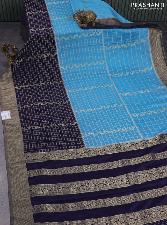 Banarasi semi crepe saree pastel blue and navy blue with allover zari checked pattern and long zari woven border