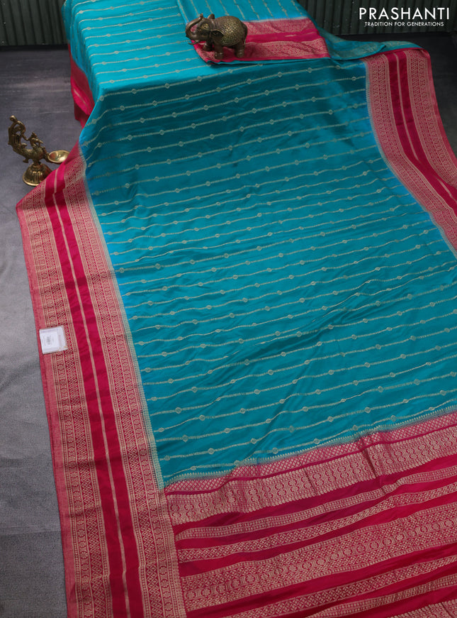 Banarasi semi crepe saree teal blue and pink with allover zari weaves and zari woven border
