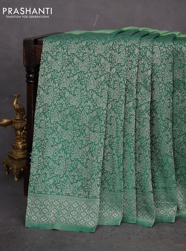 Banarasi semi crepe saree pastel green and green with allover woven buttas and long silver zari woven border