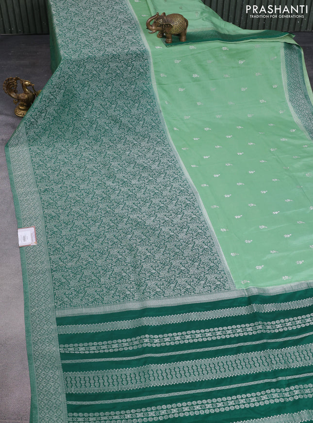 Banarasi semi crepe saree pastel green and green with allover woven buttas and long silver zari woven border