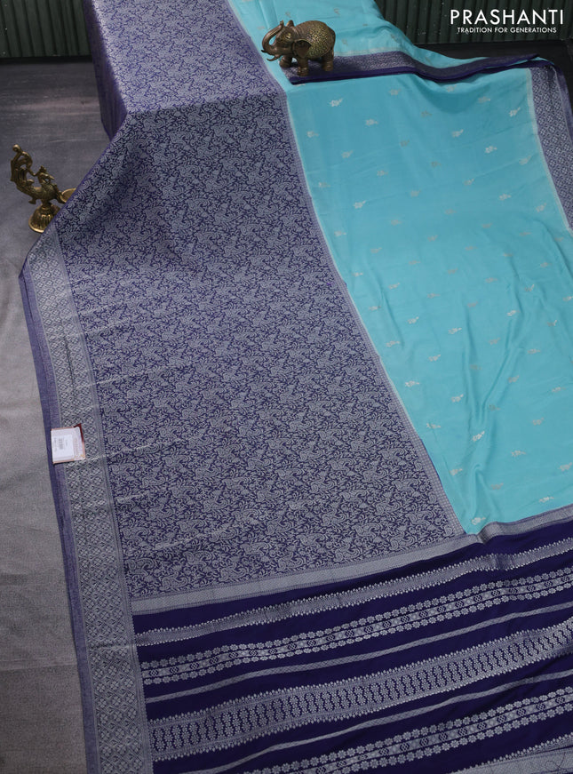 Banarasi semi crepe saree teal blue and navy blue with allover woven buttas and long silver zari woven border