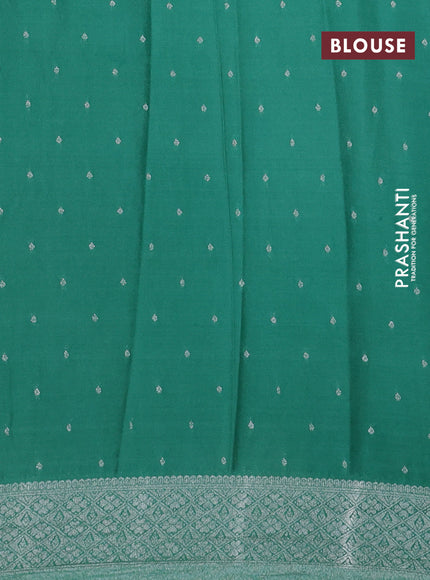 Banarasi semi crepe saree teal green shade with allover woven buttas and long silver zari woven border