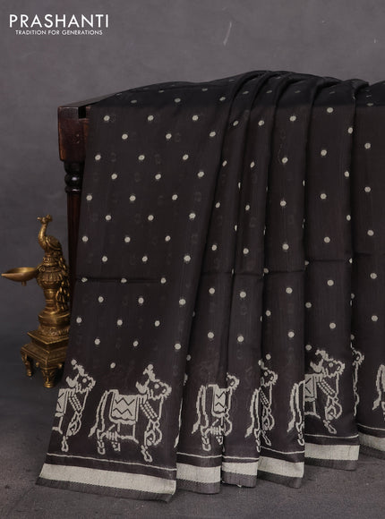 Semi tussar saree black with allover polka dot weaves and patola weaving pallu