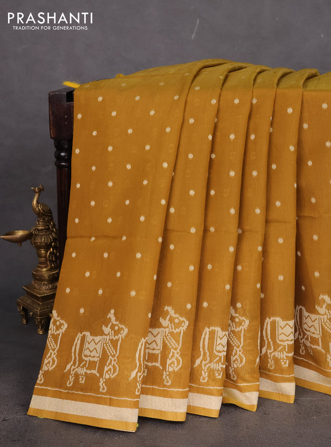 Semi tussar saree dark mustard with allover polka dot weaves and patola weaving pallu