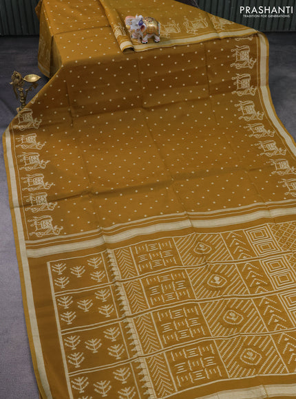 Semi tussar saree dark mustard with allover polka dot weaves and patola weaving pallu