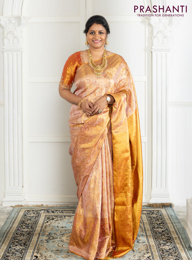 Kanchipuram tissue silk saree dual shade of pink and red with allover zari woven brocade weaves and zari woven border
