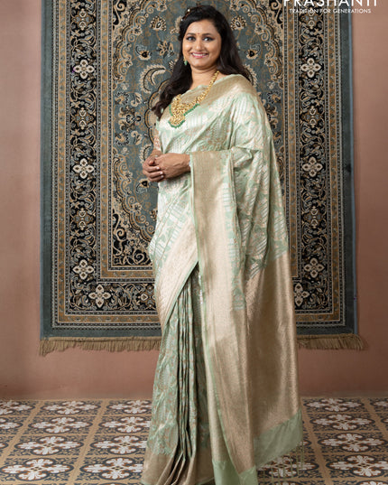 Banarasi uppada silk saree pista green with allover silver & gold zari weaves and zari woven border