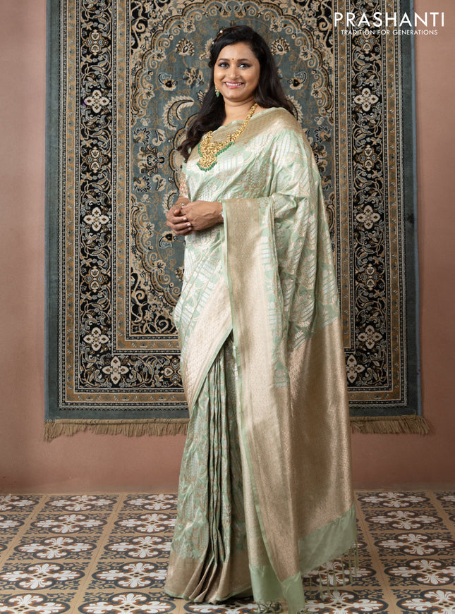 Banarasi uppada silk saree pista green with allover silver & gold zari weaves and zari woven border