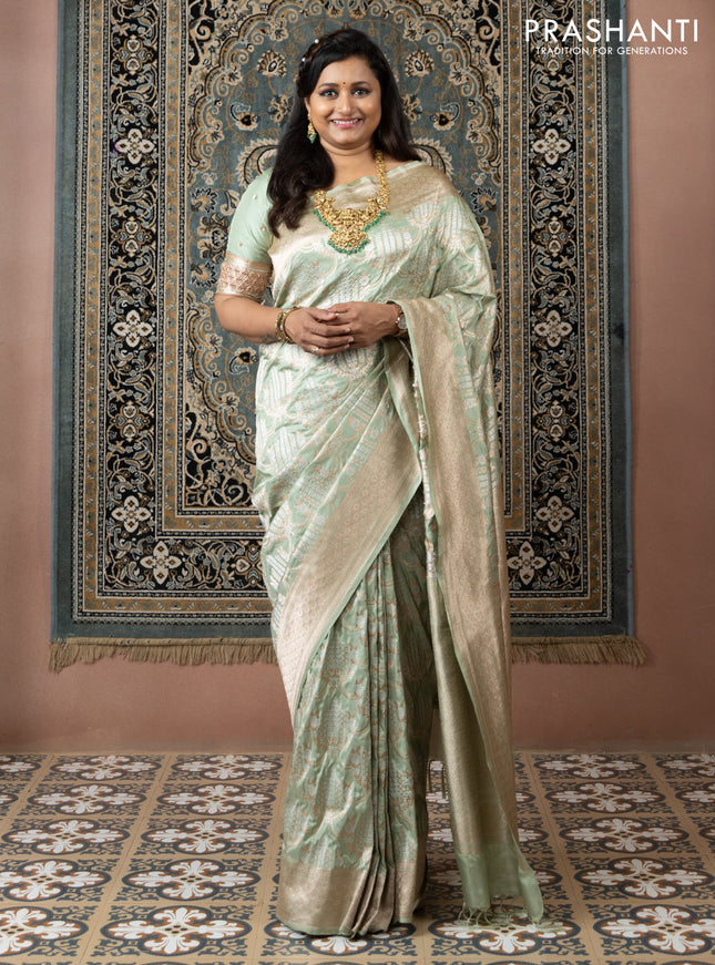 Banarasi uppada silk saree pista green with allover silver & gold zari weaves and zari woven border