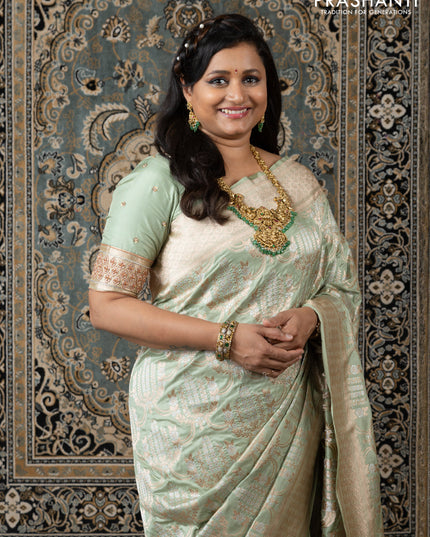 Banarasi uppada silk saree pista green with allover silver & gold zari weaves and zari woven border