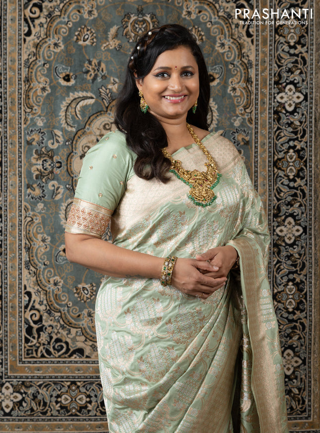 Banarasi uppada silk saree pista green with allover silver & gold zari weaves and zari woven border