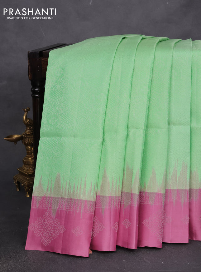 Pure soft silk saree pista green and mauve pink with allover zari woven geometric weaves and silver zari woven border