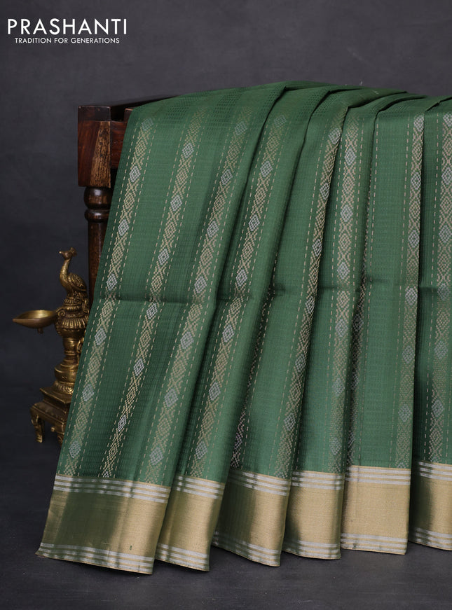 Pure soft silk saree green with allover zari weaves and zari woven simple border