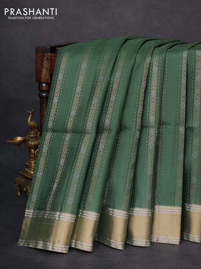 Pure soft silk saree green with allover zari weaves and zari woven simple border